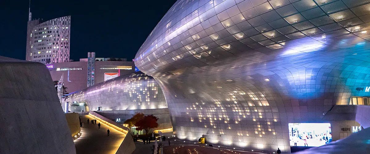 The Dongdaemun Design Plaza is a futuristic landmark by Zaha Hadid. Learn about the architect and the year-round events like Seoul Fashion Week, exhibitions, and Seoul light DDP.